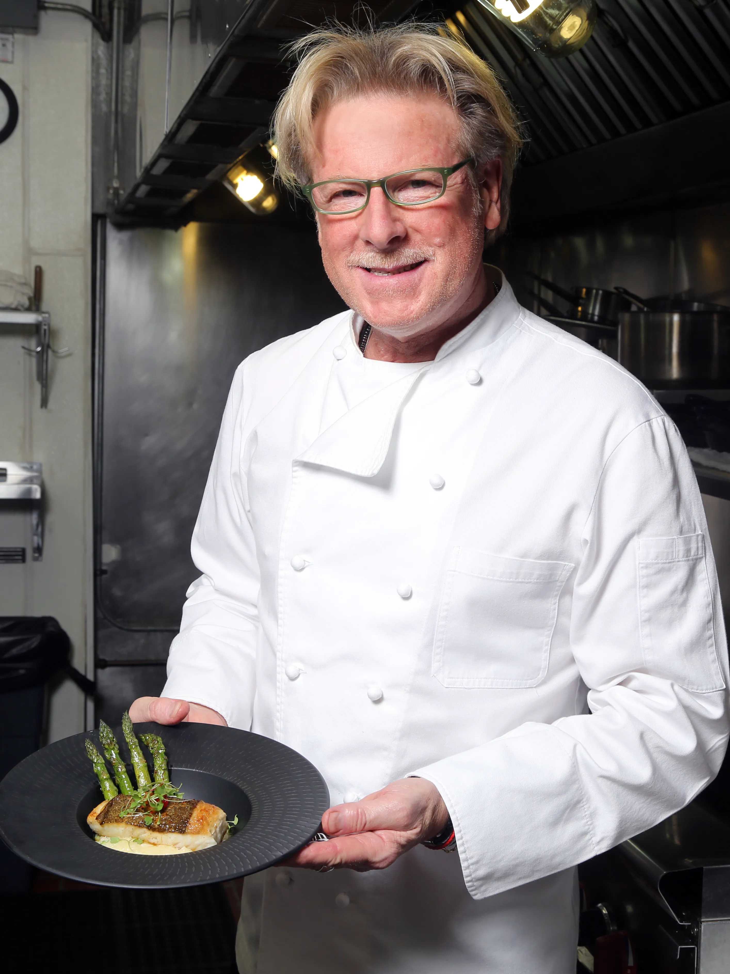 Chef Marco Rossi preparing fresh Italian cuisine